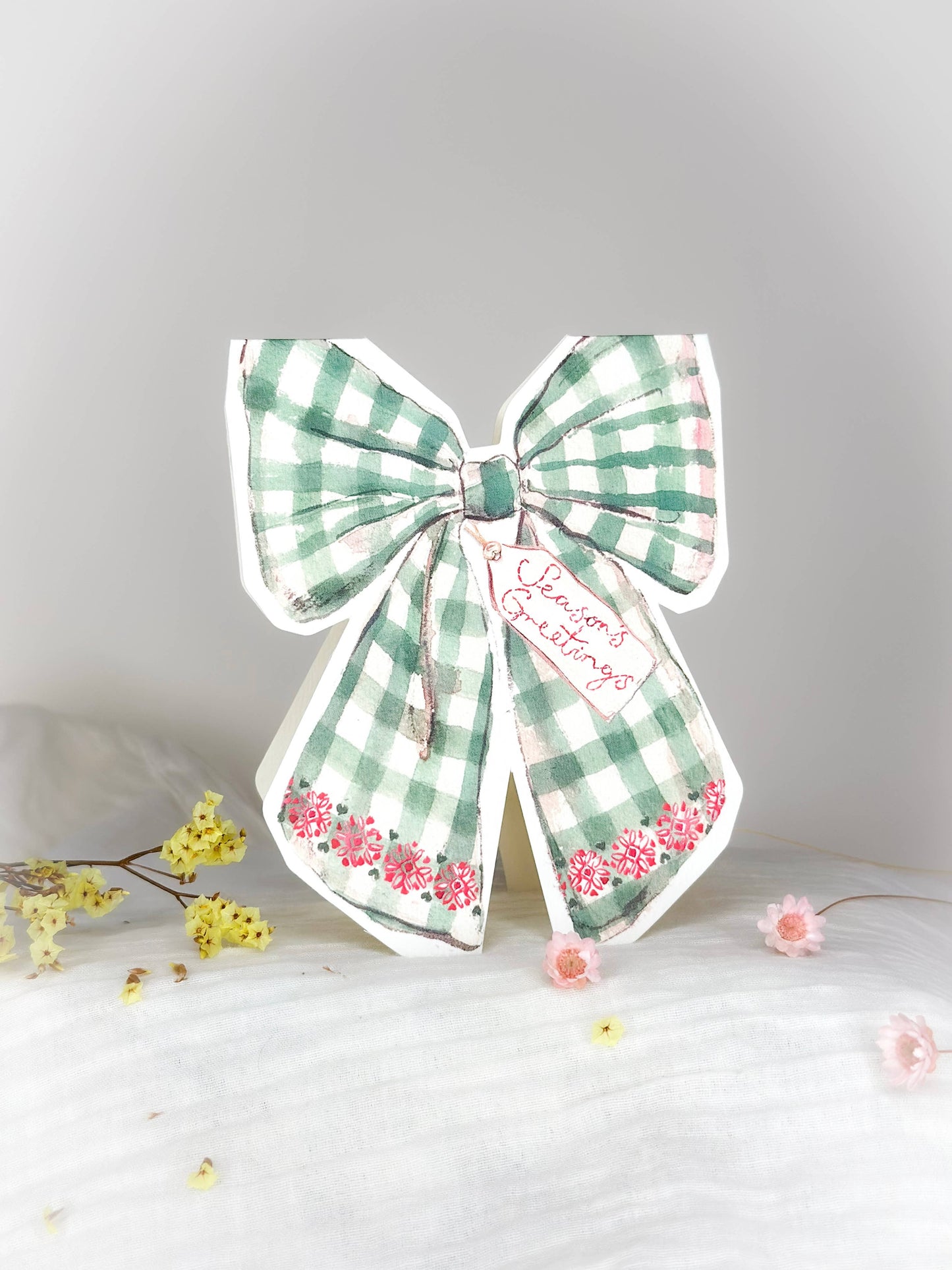 Season's Greetings bow shaped Christmas card